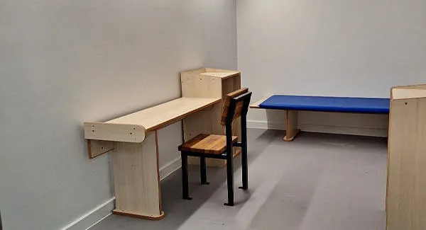 A simulation space dressed as a mock prison cell