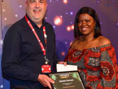 Jay Vernon receiving his award for Academic Mentor of the Year