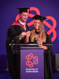 Ashley and Danielle Farrant in their graduationg caps and gowns