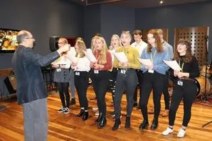 University staff and students from Music and Sound singing their song