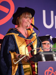 Cllr Abi Brown OBE in her honorary doctorate cap and gown