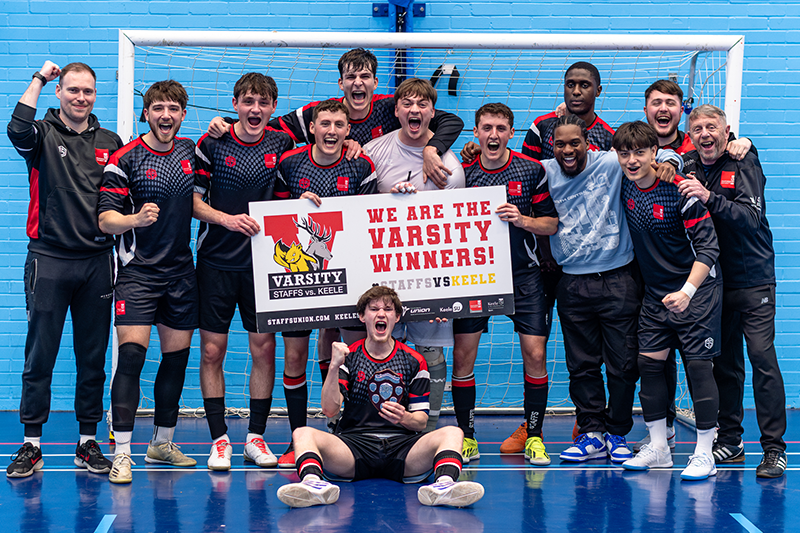 The Futsal team celebrating their Varsity win