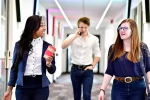 People in business clothes walking and talking