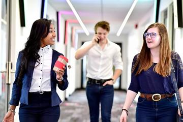 People in business clothes walking and talking