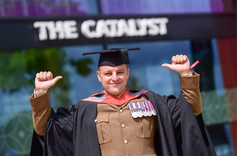 Jamie Duffill in his graduation cap and gown
