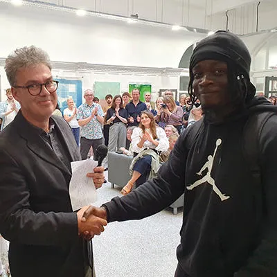 Jeffrey receiving his prize