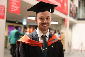 Nathan Coley in his graduation cap and gown