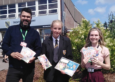 School pupils holding the Book of Nonsense