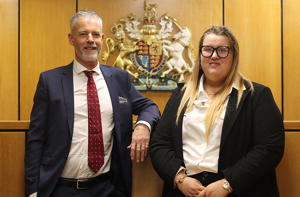 Peter Heath and Jessica Sample stood in a mock law court