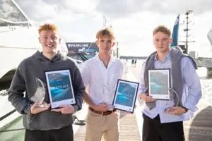 James pictured with the two other winners holding their certificate