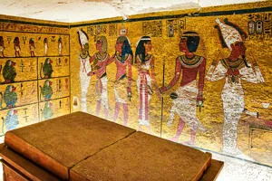 The inside of Tutankhamun's tomb with paintings of people on the walls