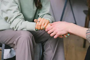 Women holding hands